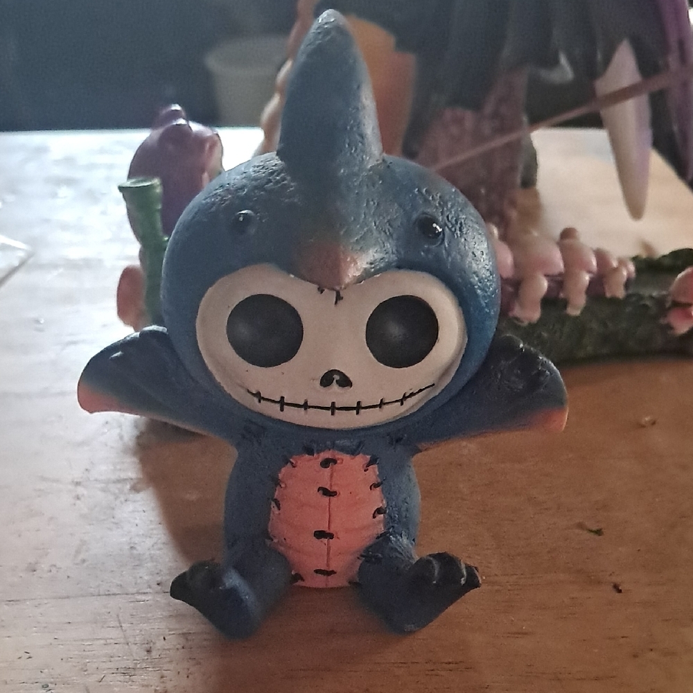 Blue and Pink Action Figure with Skull Design
